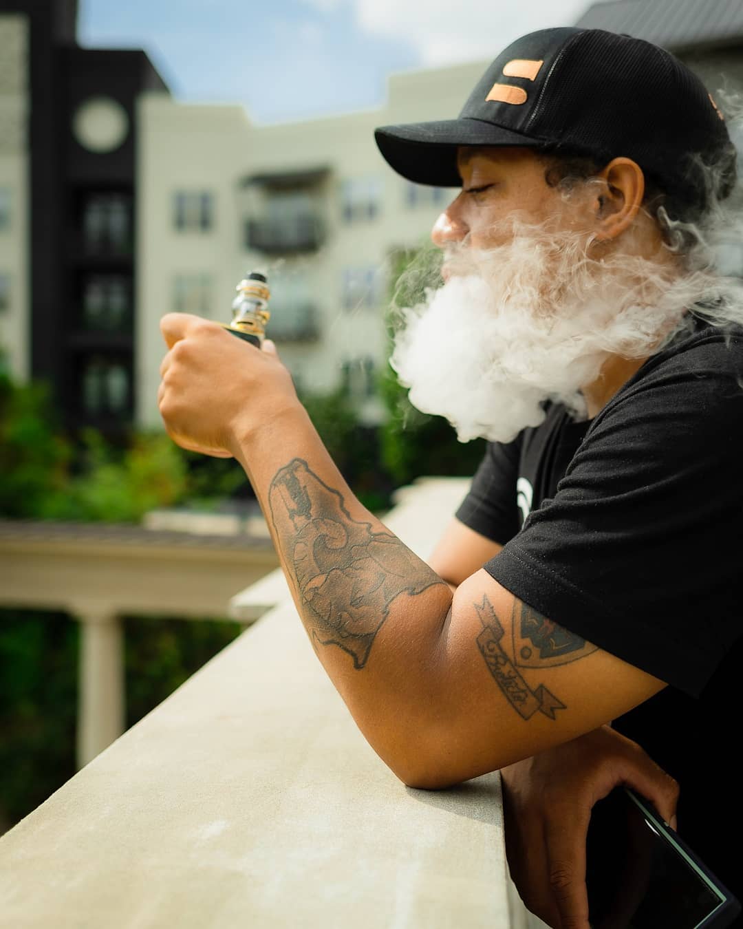 Lifestyle portrait, subject exhaling smoke